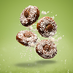 Image showing Flying chocolate glazed donuts