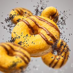 Image showing Flying delicious classic donuts