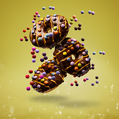 Image showing Flying donuts with firecracker