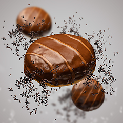 Image showing Flying doughnuts with chocolate glaze