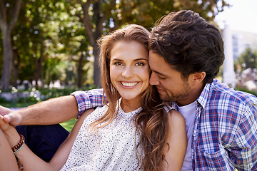 Image showing Happy couple, bonding or love date hug on grass, nature park or garden on valentines day, romance or anniversary celebration. Smile, woman or man in relax environment, support or partnership picnic