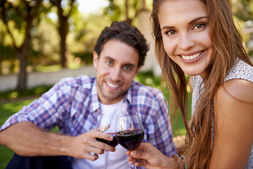 Image showing Happy couple, portrait or wine toast for love picnic, valentines day or romance date bonding in nature park or garden. Smile, woman or man and alcohol drinks glass in marriage anniversary celebration