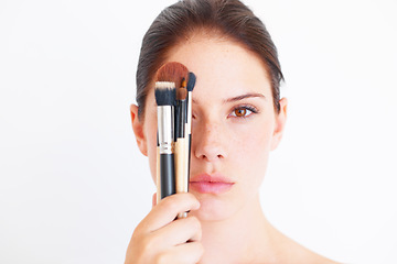 Image showing Woman, face and makeup brush in portrait, beauty and cosmetics isolated on white background. Mockup space, female in studio with cosmetic tools in hand and skincare, dermatology glow and wellness