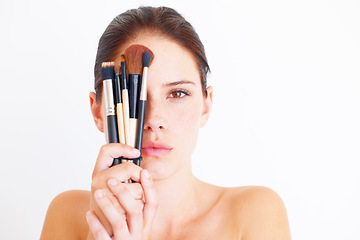 Image showing Woman, face and makeup tools in portrait, beauty and cosmetics isolated on white background. Mockup space, female in studio with cosmetic brush in hands and skincare, dermatology glow and wellness