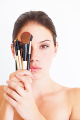 Image showing Woman, face and makeup brush in hands, portrait and beauty with cosmetics isolated on white background. Cosmetology, female in studio with cosmetic tools and skincare, dermatology glow and wellness