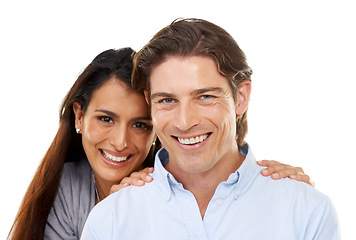 Image showing Love, hug and portrait of a couple in a studio for valentines day, romance or anniversary. Happy, smile and young interracial man and woman embracing with happiness isolated by a white background.