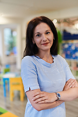 Image showing Portrait of a teacher in a preschool institution, in the background of the classrooms