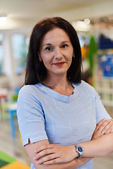 Image showing Portrait of a teacher in a preschool institution, in the background of the classrooms