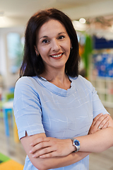 Image showing Portrait of a teacher in a preschool institution, in the background of the classrooms