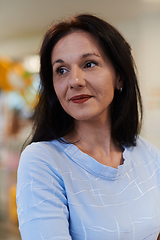 Image showing Portrait of a teacher in a preschool institution, in the background of the classrooms