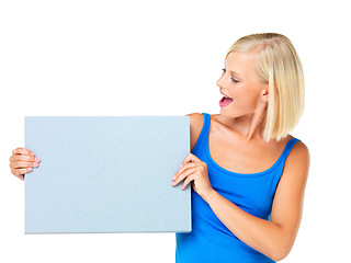 Image showing Mockup, sale and woman looking at poster advertising, marketing and billboard for logo, deal or giveaway. Paper, blonde and female showing brand on a board isolated in a studio white background