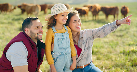 Image showing Happy family bonding on a cattle farm, happy, laughing and learning about animals in nature. Parents, girl and agriculture with family relaxing, enjoying and exploring the outdoors on an open field