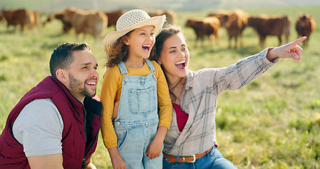 Image showing Happy family bonding on a cattle farm, happy, laughing and learning about animals in nature. Parents, girl and agriculture with family relaxing, enjoying and exploring the outdoors on an open field