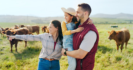 Image showing Farm, cattle and family on holiday in the countryside of Argentina for a sustainable lifestyle in summer. Mother, father and kid on the grass of a field for animal cows during a vacation in nature