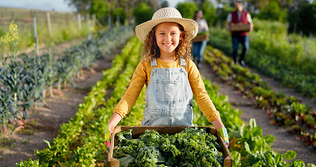 Image showing Little girl, farm and agriculture in green harvest for sustainability, organic and production in nature. Portrait of child holding crops in sustainable farming in the countryside for natural resource