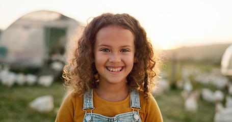 Image showing Chicken, smile and girl on a farm learning about agriculture in the countryside of Argentina. Happy, young and sustainable child with an animal, bird or rooster on a field in nature for farming