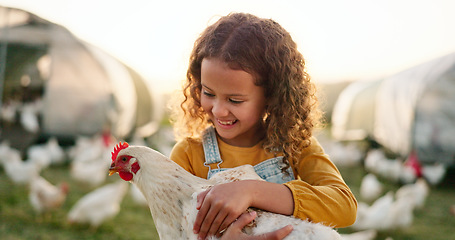 Image showing Chicken, smile and girl on a farm learning about agriculture in the countryside of Argentina. Happy, young and sustainable child with an animal, bird or rooster on a field in nature for farming