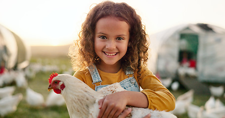 Image showing Chicken, smile and girl on a farm learning about agriculture in the countryside of Argentina. Happy, young and sustainable child with an animal, bird or rooster on a field in nature for farming