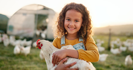 Image showing Chicken, smile and girl on a farm learning about agriculture in the countryside of Argentina. Happy, young and sustainable child with an animal, bird or rooster on a field in nature for farming