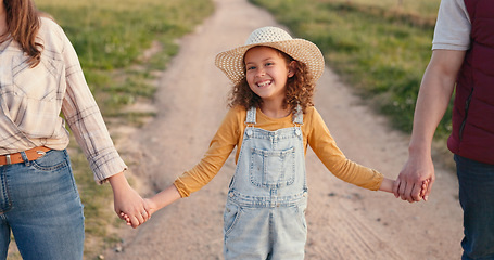 Image showing Agriculture, farming and family holding hands on farm in summer countryside. Mom, dad and portrait of young girl excited for future career in family business as farmer with parents support and love