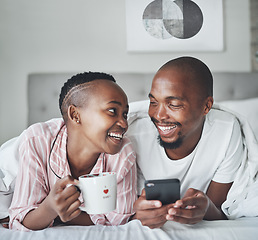 Image showing Black couple in bed with smartphone, coffee and happiness with morning routine, social media or streaming online. Wifi, communication and technology with happy man and woman, relax at home together