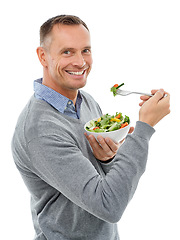 Image showing Portrait, salad and mock up with a man in studio isolated on a white background for health, diet or nutrition. Food, green and vegetables with a handsome mature male eating a meal on blank space