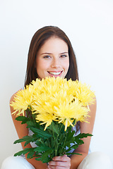 Image showing Flower bouquet, face portrait and happy woman with floral studio product, sustainable gift or yellow present. Nature growth, spring beauty and eco friendly model girl isolated on white background