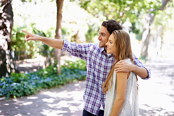 Image showing Love, couple talking and in park for summer vacation, conversation and bird watching with happiness on Valentines day. Romance, man and woman in nature, walking and discussion with smile and loving