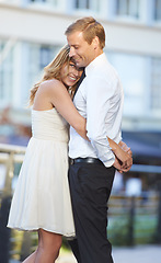 Image showing Love, couple and hug outdoor, city and happiness for Valentines day, dating and cheerful together. Romance, man and woman embrace in town, celebrate relationship and happy with hope and marriage