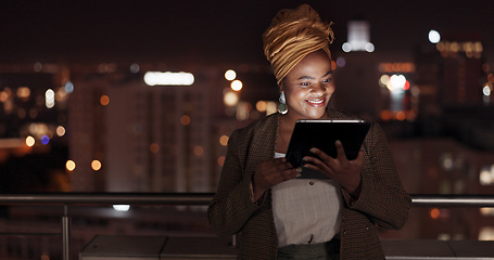 Image showing Tablet, night and balcony with a business black woman doing research online while standing outdoor at her office. Working late, search and deadlines with a female employee doing overtime at work