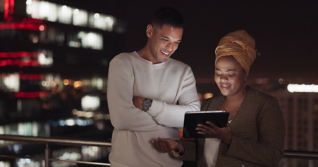 Image showing Communication, night balcony and business people working, talking or review online social media feedback. New York city rooftop, teamwork collaboration and black woman discussion on digital marketing