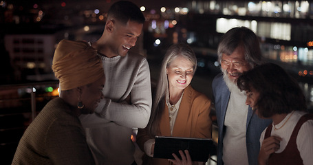 Image showing Tablet, collaboration and night with a business team working together in the city on their office balcony. Finance, teamwork and meeting with a man and woman employee group talking strategy outside