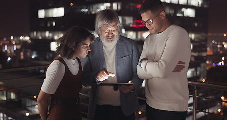 Image showing Business team, tablet and night on city building rooftop talking global networking, digital marketing and social media. Man and woman with 5g network on mobile stock market app for innovation idea