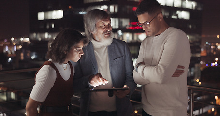 Image showing Business team, tablet and night on city building rooftop talking global networking, digital marketing and social media. Man and woman with 5g network on mobile stock market app for innovation idea