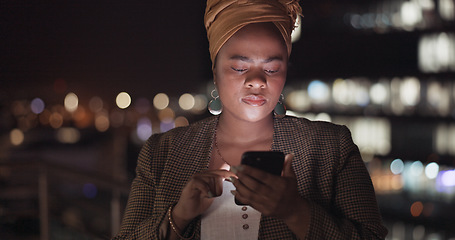 Image showing Search, night and phone with business woman in city for communication, social media and networking. Internet, technology and email with black woman on rooftop for app, data and news in New York