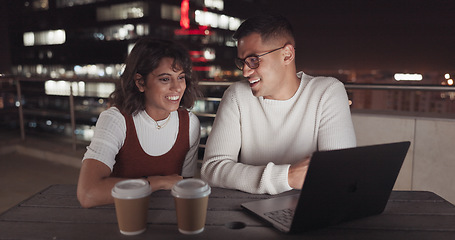 Image showing Laptop, collaboration and night with a business team working together on balcony in the city. Teamwork, computer and overtime with a man and woman employee at work late on a project deadline