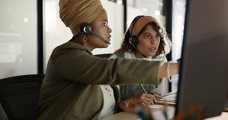 Image showing Call center, training and black woman coaching recruit at customer service agency in Africa. Diversity, teamwork and crm, telemarketing manager consulting woman at desk for customer support help line