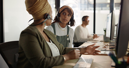 Image showing Call center, training and black woman coaching recruit at customer service agency in Africa. Diversity, teamwork and crm, telemarketing manager consulting woman at desk for customer support help line