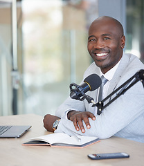 Image showing Broadcast, portrait and black man with microphone, radio podcast or content creation in office, laptop and planning. Virtual reporter, news speaker or journalist speaking on live streaming audio show