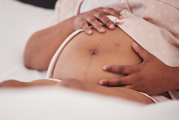 Image showing Pregnant, woman and hands on stomach for feeling, bonding and relax in bed, calm and content. pregnancy, female and hand on belly in a bedroom, touch, care and loving while resting alone in her home