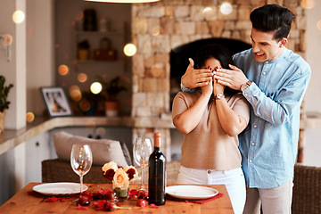 Image showing Couple surprise, romantic home dinner and man cover womans eyes for fine dining, red wine or Valentines day date. Marriage anniversary love, rose petals and happy people celebrate holiday event