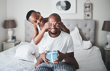 Image showing Surprise, gift and couple in bedroom with box for anniversary, valentines day or birthday celebration. Love, dating and black woman cover eyes of man for present for romance, affection and bonding