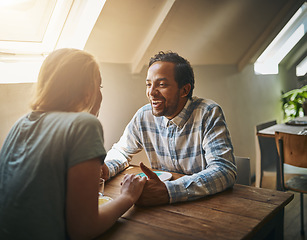 Image showing Valentines couple, love and holding hands at restaurant on table, talking and laughing at joke. Comic, romance diversity and affection of man and woman on date, having fun and enjoying quality time.