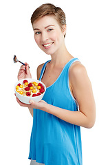 Image showing Breakfast, fruit and portrait of a woman in studio eating snack, meal or craving for nutrition. Happy, smile and young female model enjoying healthy granola for wellness isolated by white background.