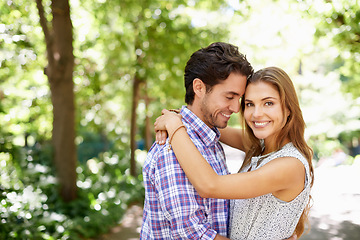 Image showing Portrait, hug and couple in a park for date, valentines day and bonding while embracing against a blurred background. Face, love and man hugging woman in nature, excited or romantic outside in Mexico