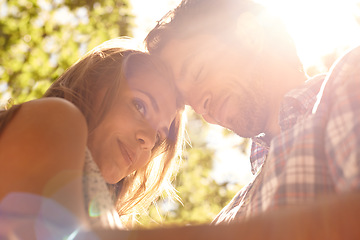 Image showing Lens flare, couple or forehead touch on love date, valentines day or bonding hug in nature park, relax garden or low angle. Smile, happy man or embrace woman in trust, security or partnership support