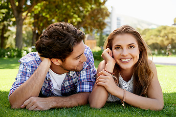 Image showing Couple, portrait or love date on grass, nature park or garden bonding on valentines day, romance or anniversary celebration. Smile, happy woman or man lying in relax environment or partnership picnic