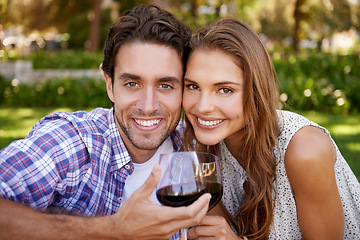 Image showing Love couple, portrait or wine toast for picnic, valentines day or romance date bonding in nature park or garden. Smile, happy woman or man and alcohol drinks glass in marriage anniversary celebration