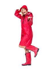 Image showing Red raincoat, portrait and excited woman in studio with white background and mockup. Model, smile and young person with happiness for winter rain and storm with waterproof clothes in mock up