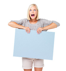 Image showing Mockup, shock and surprise on woman with a poster advertising, marketing and billboard for sale, deal or giveaway. Portrait, blonde and female showing brand on a board isolated in a white studio